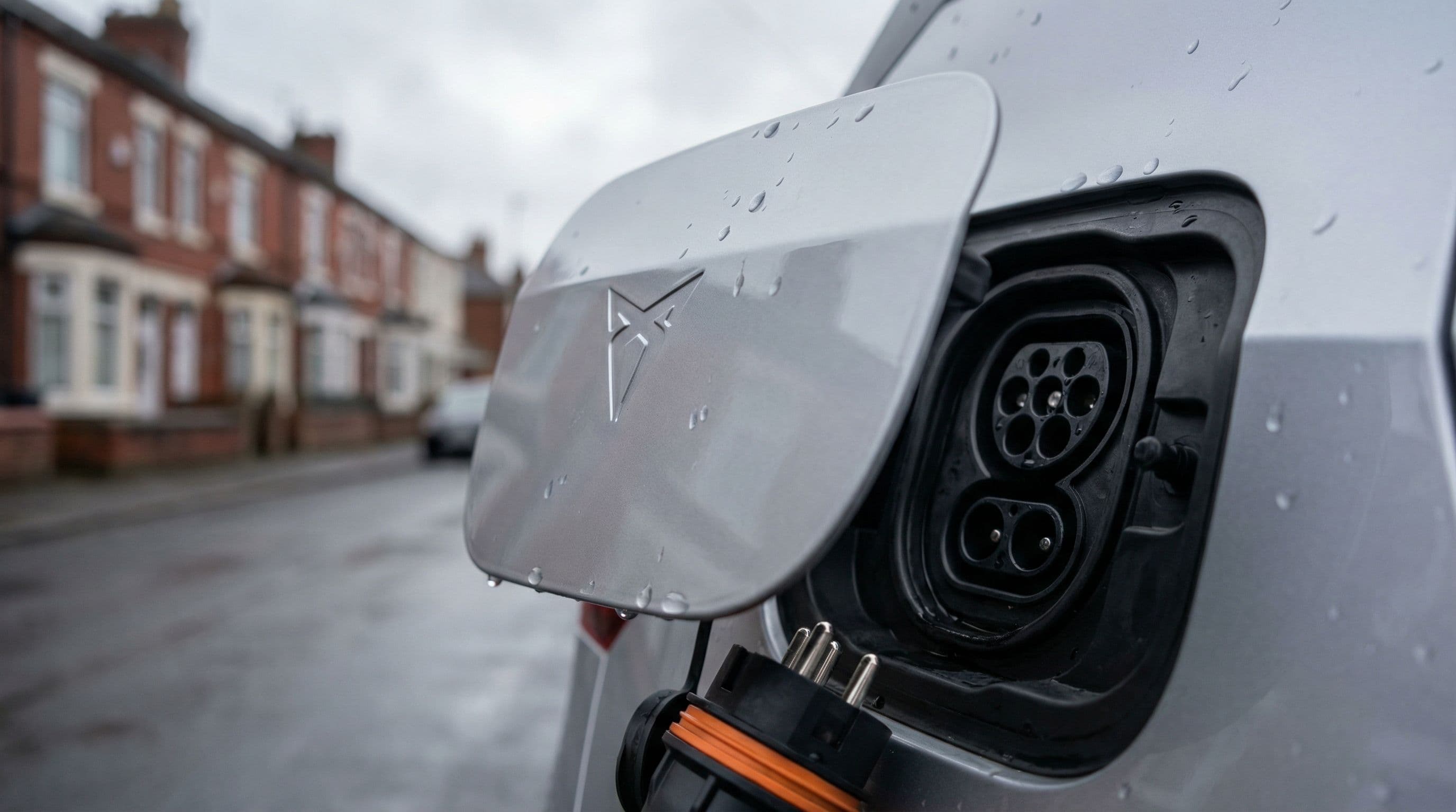 Cupra Born's charging port shows the interface updated in latest model revisions.
