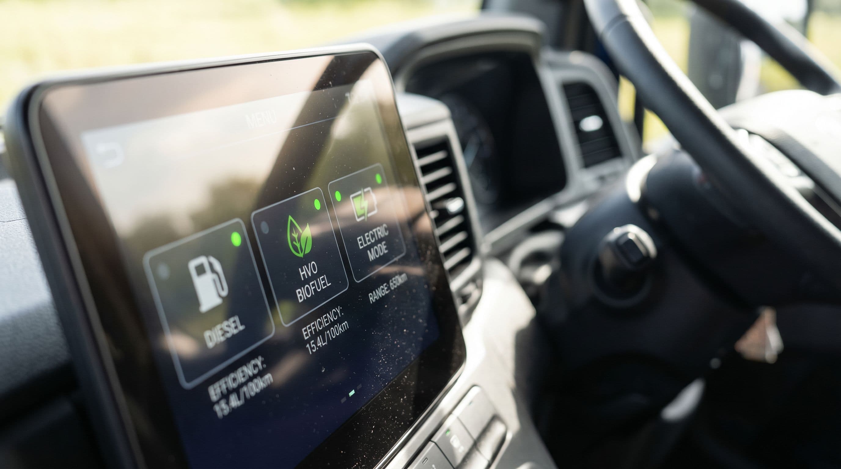 Multi-fuel dashboard display demonstrates HGV industry's technological flexibility approach.