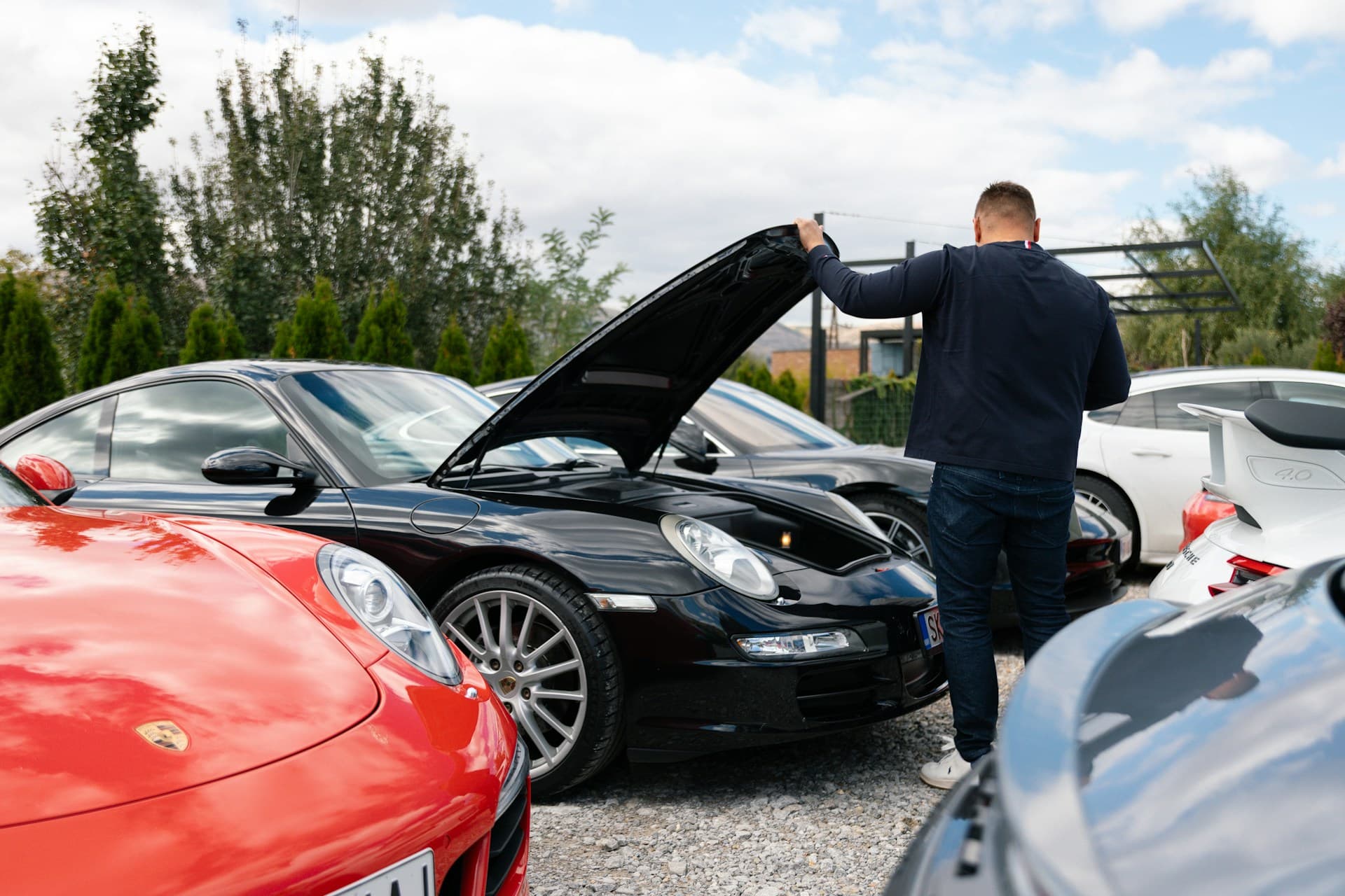 Mechanic inspecting car on lift