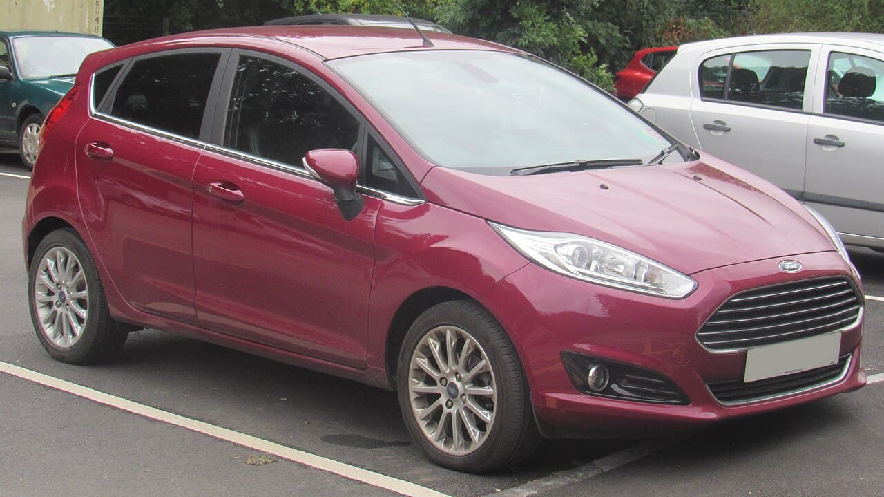 A red 2014 Ford Fiesta Titanium X 1.0 EcoBoost parked in a car park
