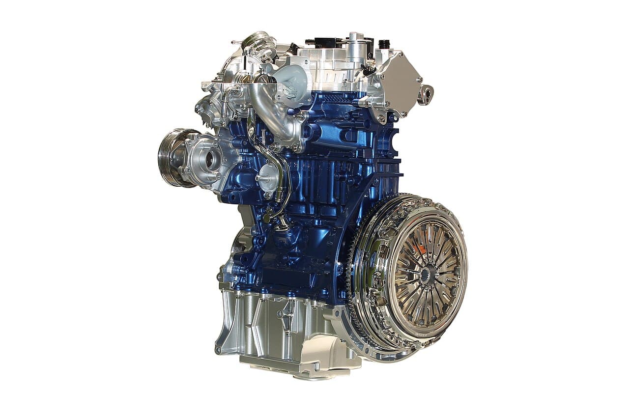 The Ford 1.0 EcoBoost three-cylinder petrol engine on a white background